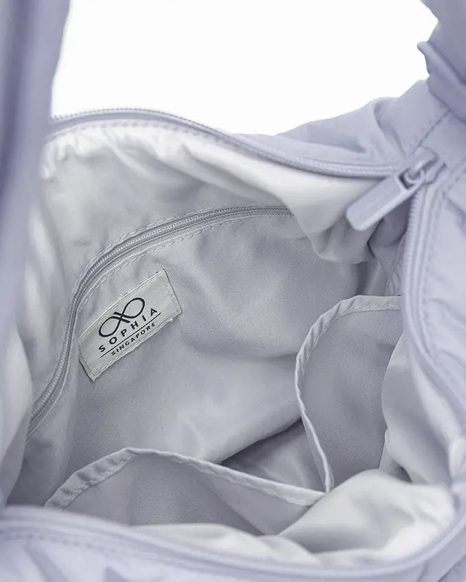 SIGNATURE POCKET CROSSBODY BAG IN COSY LUXE LILAC 