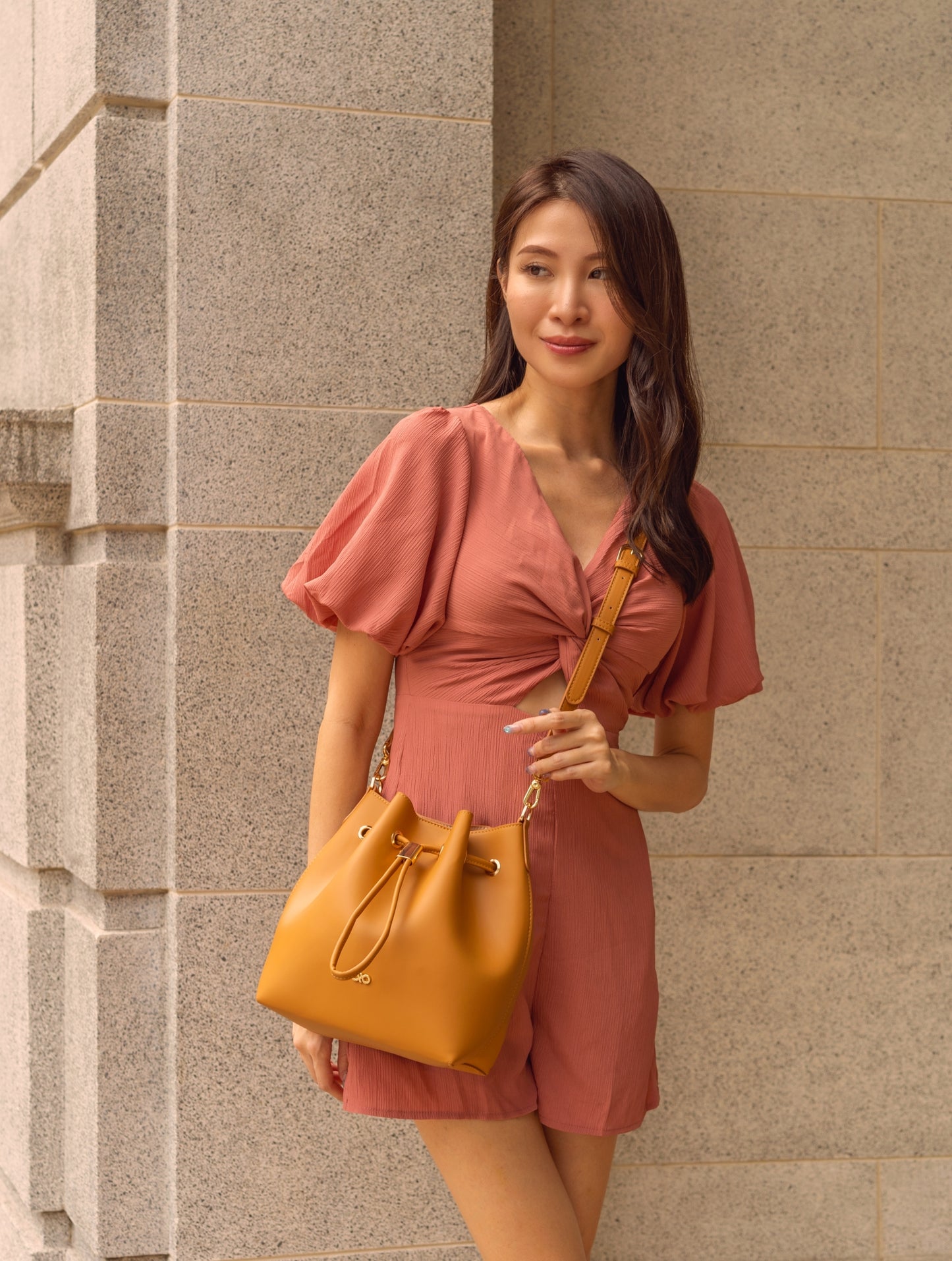 MINI REINA MAGIC BUCKET BAG IN CAMEL